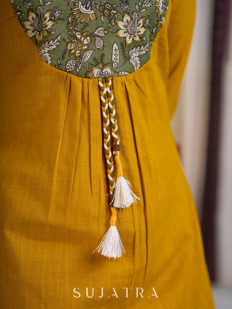 Vibrant Mustard Cotton Kurta with Olive Floral Print Yoke and Statement Tassel Embellishment