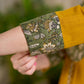 Vibrant Mustard Cotton Kurta with Olive Floral Print Yoke and Statement Tassel Embellishment
