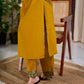 Vibrant Mustard Cotton Kurta with Olive Floral Print Yoke and Statement Tassel Embellishment