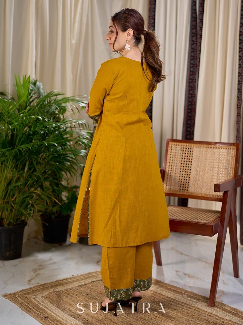 Vibrant Mustard Cotton Kurta with Olive Floral Print Yoke and Statement Tassel Embellishment