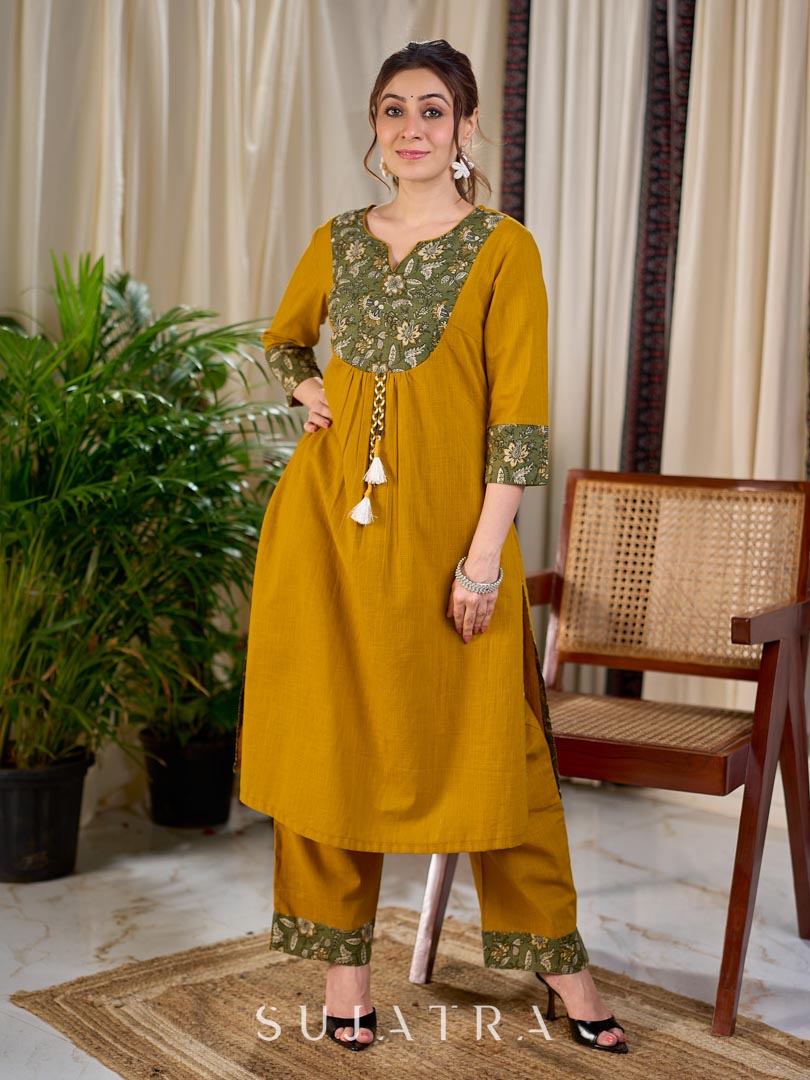 Vibrant Mustard Cotton Kurta with Olive Floral Print Yoke and Statement Tassel Embellishment
