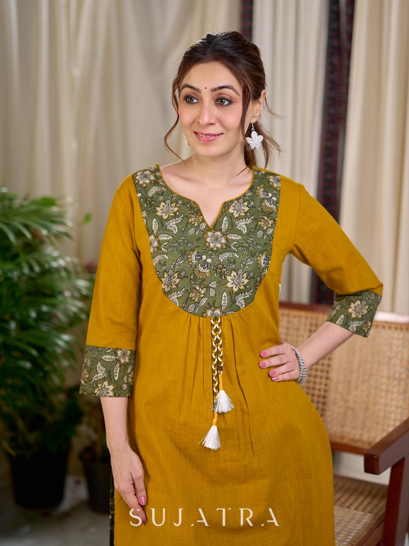 Vibrant Mustard Cotton Kurta with Olive Floral Print Yoke and Statement Tassel Embellishment