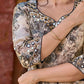 Elegant black–white floral kurta featuring a graceful bias silhouette, intricate mirror embroidery on the neck and sleeves, and a sweetheart neckline.