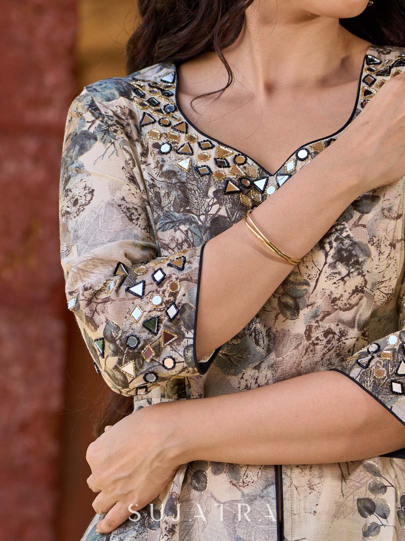 Elegant black–white floral kurta featuring a graceful bias silhouette, intricate mirror embroidery on the neck and sleeves, and a sweetheart neckline.