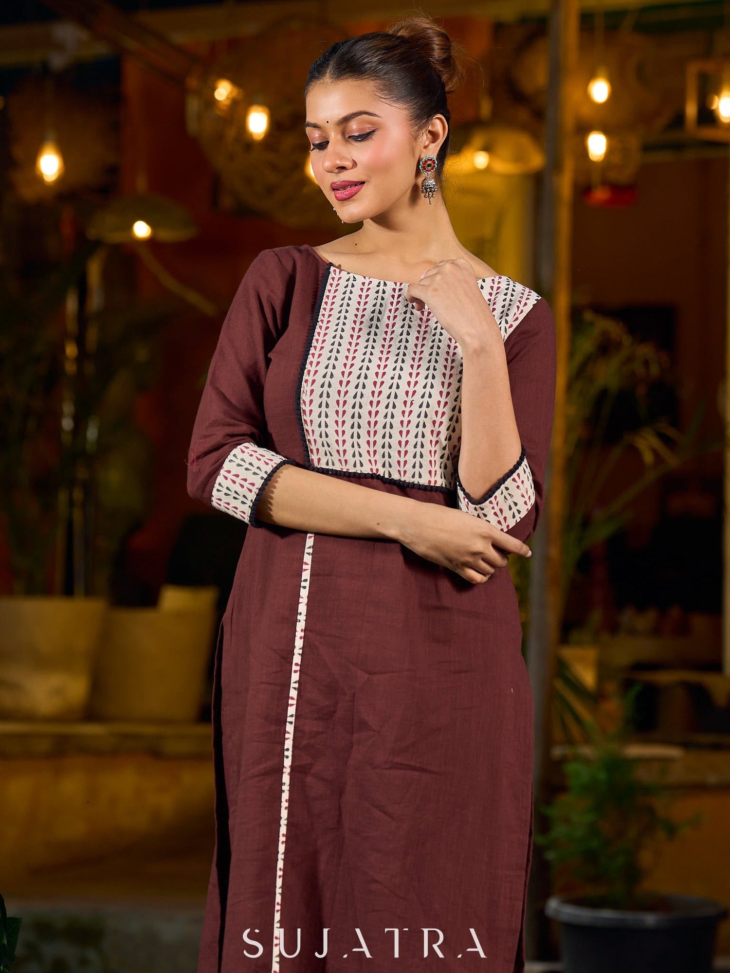 Brown cotton straight kurta with white Ajrakh patch and black accents.