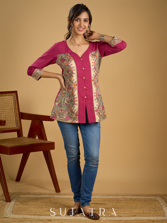 Madhubani print add charm to this magenta cotton top.