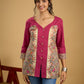 Madhubani print add charm to this magenta cotton top.