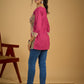 Madhubani print add charm to this magenta cotton top.
