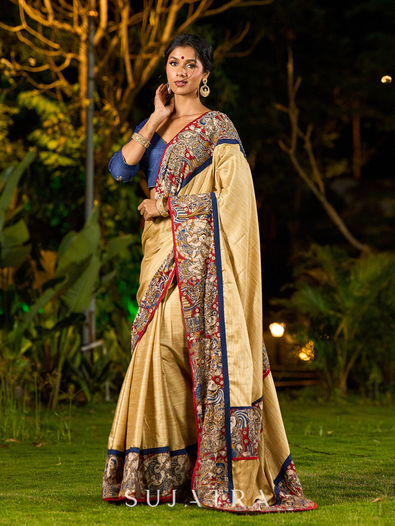 Folk-Inspired Golden Assam Silk Saree with Kalamkari Embroidered Border & Trim