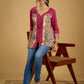Madhubani print add charm to this magenta cotton top.