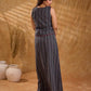Textured grey Jamdani sleeveless waistcoat with bold red accents and an asymmetrical opening, creating a sharp, modern silhouette with distinctive, fashion-forward appeal.