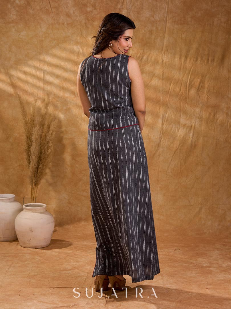 Textured grey Jamdani sleeveless waistcoat with bold red accents and an asymmetrical opening, creating a sharp, modern silhouette with distinctive, fashion-forward appeal.
