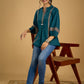 Elegant cotton teal top featuring graceful and unique detailing.