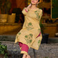 Handcrafted mustard kurta with stripe–floral print and magenta accents.