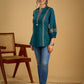Elegant cotton teal top featuring graceful and unique detailing.