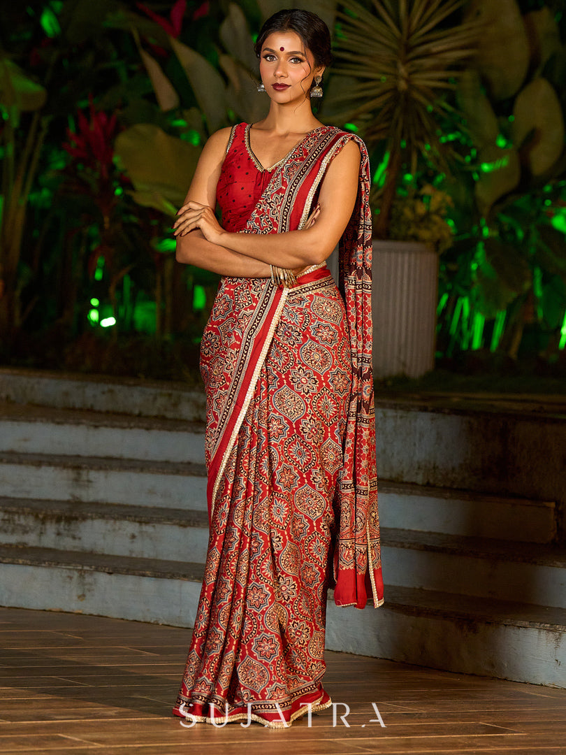 Striking Maroon Modal Silk Saree with Traditional Ajrakh Print & Contrast Gold Lace Detail & Hand Embroidered Pallu