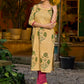 Handcrafted mustard kurta with stripe–floral print and magenta accents.