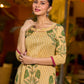 Handcrafted mustard kurta with stripe–floral print and magenta accents.