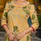 Handcrafted mustard kurta with stripe–floral print and magenta accents.