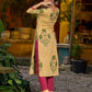 Handcrafted mustard kurta with stripe–floral print and magenta accents.