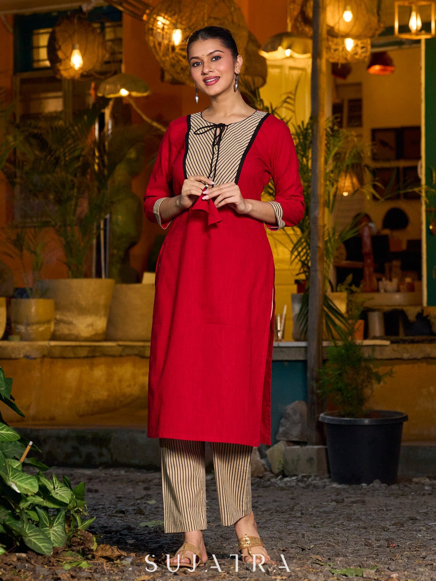 Elegant red kurta featuring a V-shaped striped neck panel