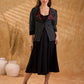 Exquisite black Ikat jacket with offset collar flaps and detailed red floral vine embroidery, delivering a sculpted, high-impact silhouette with refined presence for corporate styling.