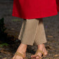 Elegant red kurta featuring a V-shaped striped neck panel