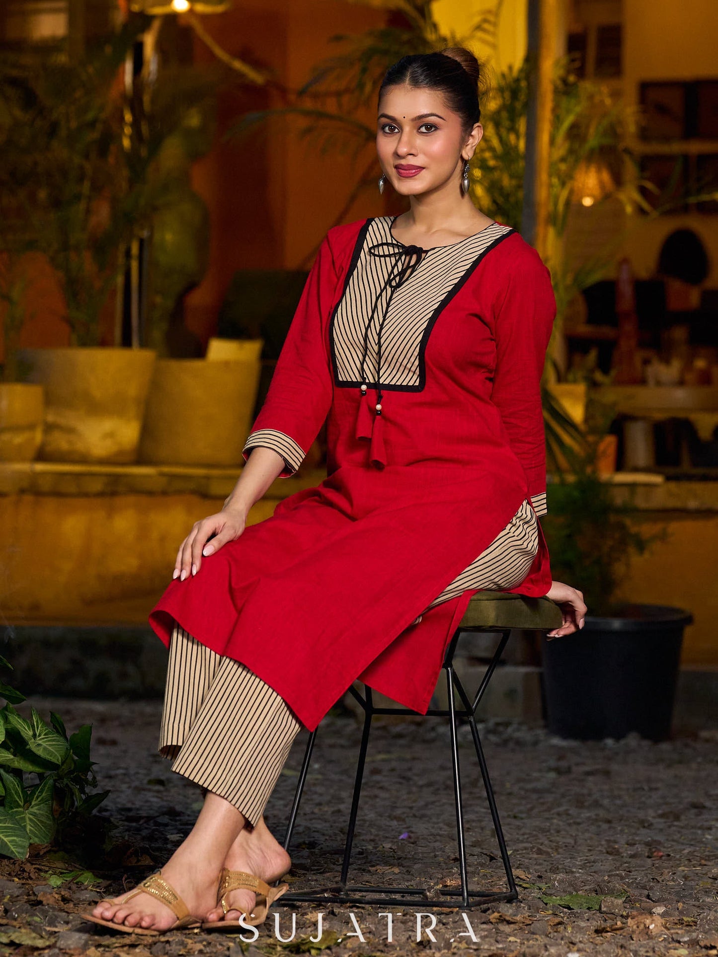 Elegant red kurta featuring a V-shaped striped neck panel