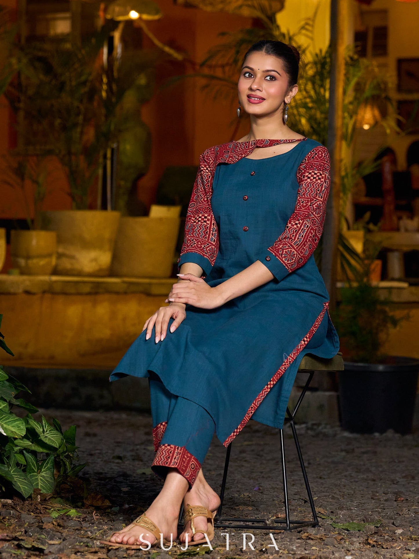 Teal kurta with contrasting Ajrakh sleeves and a chic neck cut