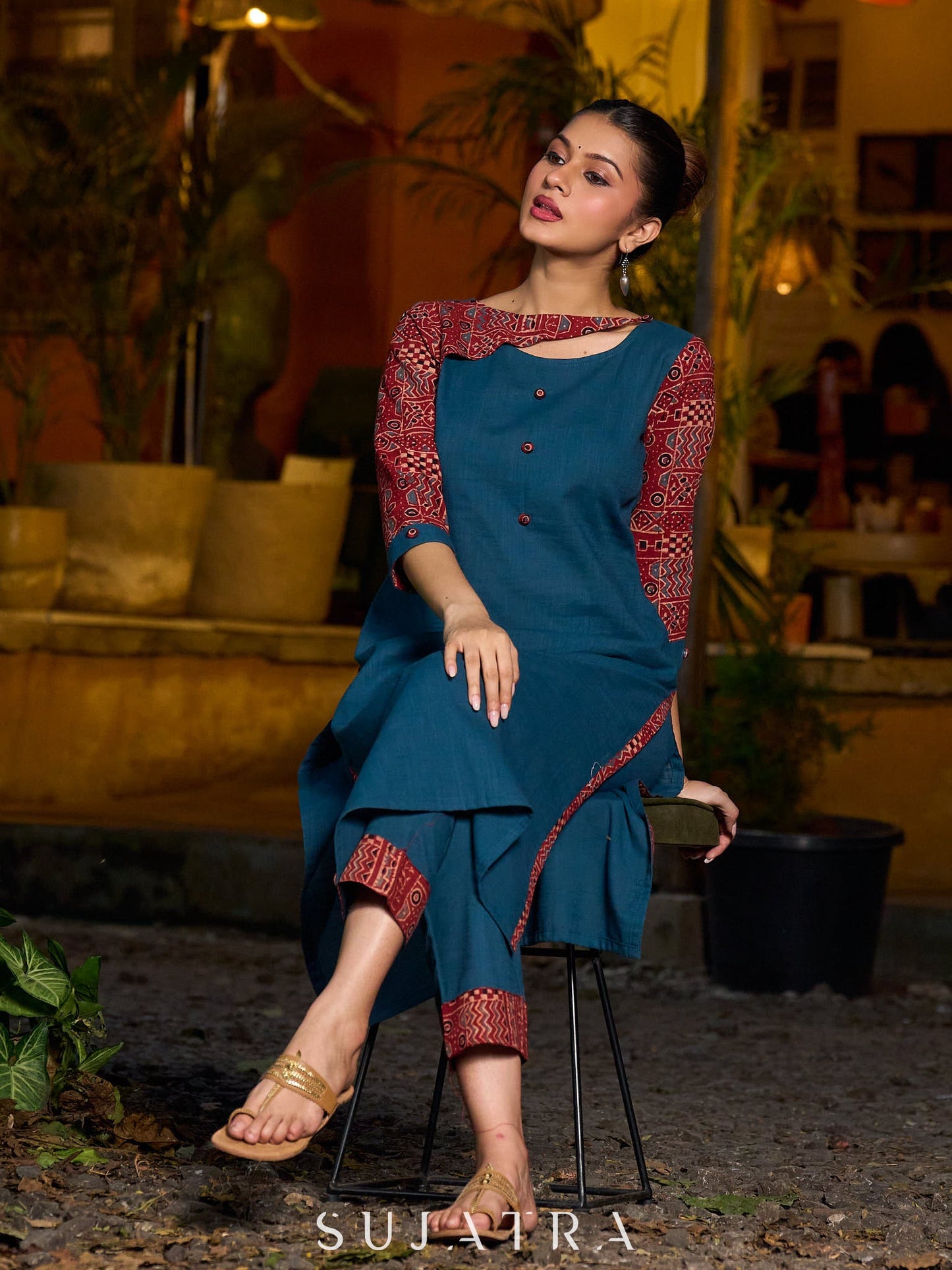 Teal kurta with contrasting Ajrakh sleeves and a chic neck cut