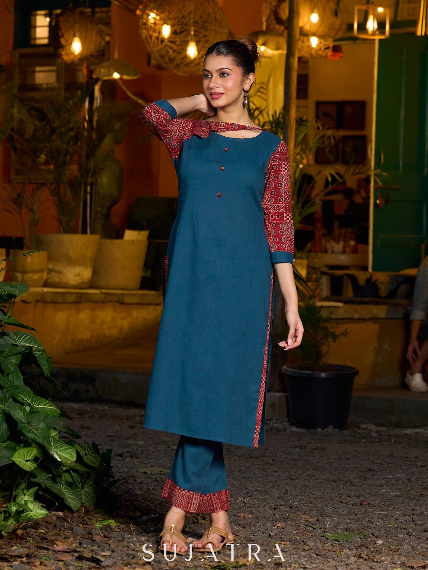 Teal kurta with contrasting Ajrakh sleeves and a chic neck cut