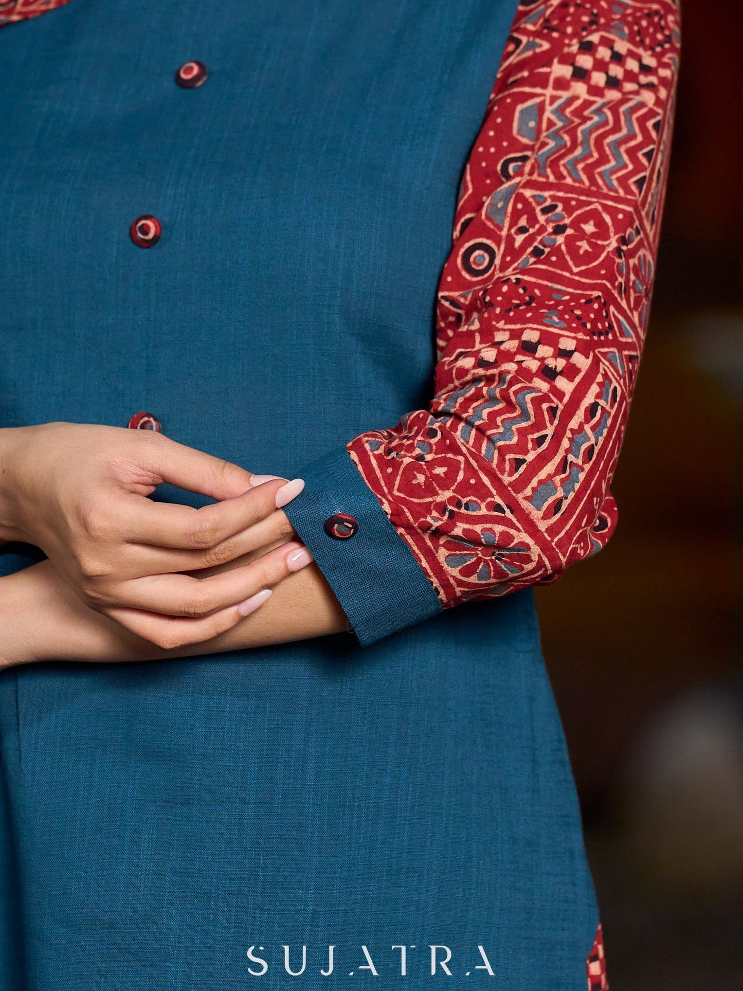 Teal kurta with contrasting Ajrakh sleeves and a chic neck cut