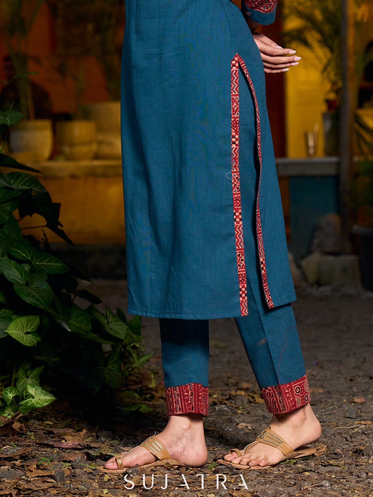 Teal kurta with contrasting Ajrakh sleeves and a chic neck cut