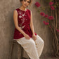 Charming red hand block print top showcasing elegant floral motifs, a contemporary pleated silhouette, and refined detailing, blending artisanal craftsmanship with effortless everyday style.