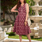 Statement maroon Ikat sleeveless dress elevated with pintuck detailing through the bodice and box pleats beyond the darts for a soft, flowing finish.