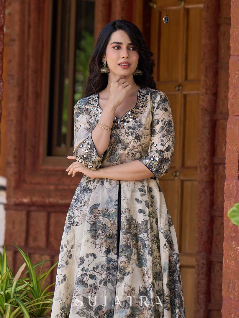 Elegant black–white floral kurta featuring a graceful bias silhouette, intricate mirror embroidery on the neck and sleeves, and a sweetheart neckline.
