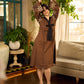 Brown block print dress with floral block printed flared sleeves, black tie-up neckline, and contrast black accents for an effortless, elegant everyday look.