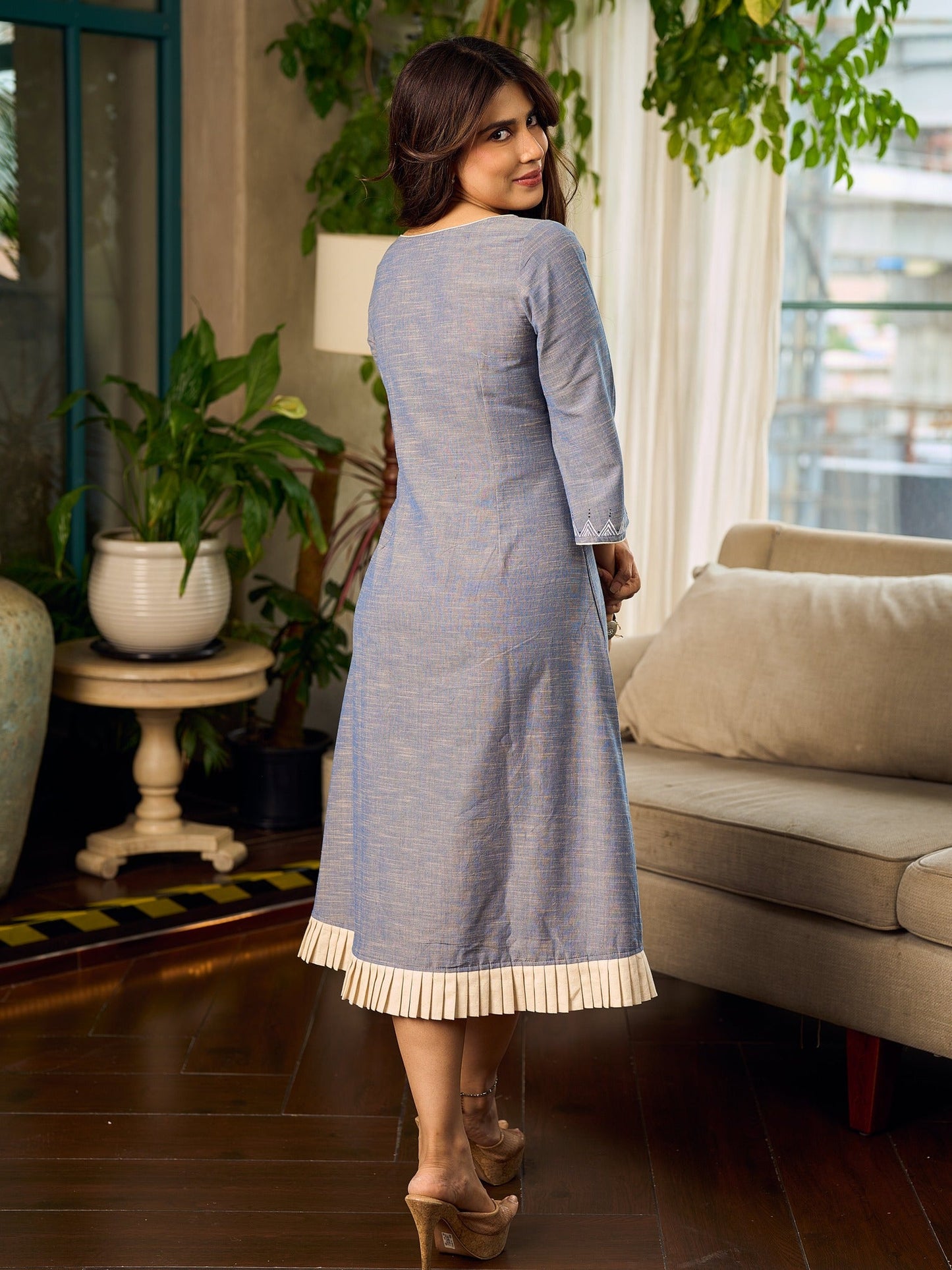 Two-tone handloom cotton dress with delicately painted Madhubani fish motifs and pleated hem.