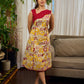 Elegant cream and maroon Madhubani dress featuring sophisticated wavy pintuck flap detailing.