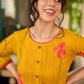Mustard block printed pintuck dress with hand block red and pink vine floral motifs, accented with red and olive details for a rich, elegant look.