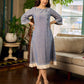 Two-tone handloom cotton dress with delicately painted Madhubani fish motifs and pleated hem.