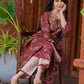 Exquisite deep maroon printed kurta with a graceful bias silhouette, intricate handwork on the yoke, and scalloped sleeve detailing.
