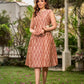 Chic champagne beige Ikat dress elevated with Hakoba accents, a relaxed drop-shoulder fit, mandarin neckline, and fluid side gathers detailed with Hakoba flaps.