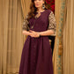 Playful purple cotton dress showcasing floral puff sleeves and box pleats released from the dart for soft volume and flow