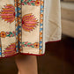 Artisan-crafted off-white Madhubani dress with beautiful hand-painted motifs and trim.