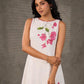 White and pink bougainvillea printed statement dress with pearl embellishments and pink accents
