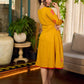 Mustard block printed pintuck dress with hand block red and pink vine floral motifs, accented with red and olive details for a rich, elegant look.