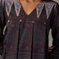 Black Ajrakh printed dress with pleats, maroon accents, and silver embellishments.