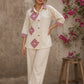 Vibrant ivory hand block print shirt featuring geometric motifs, magenta accents, and a contemporary silhouette inspired by traditional craftsmanship.