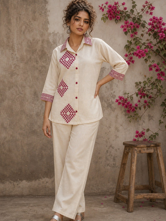 Vibrant ivory hand block print shirt featuring geometric motifs, magenta accents, and a contemporary silhouette inspired by traditional craftsmanship.